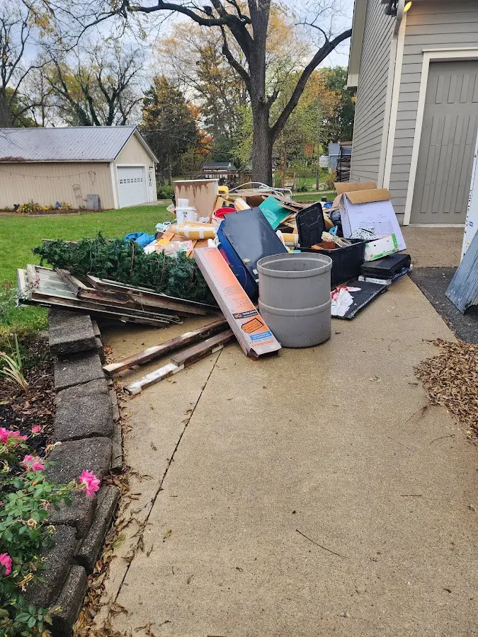 Dumpster being loaded with debris for 3 Yard Dumpster Rental in Olivehurst
